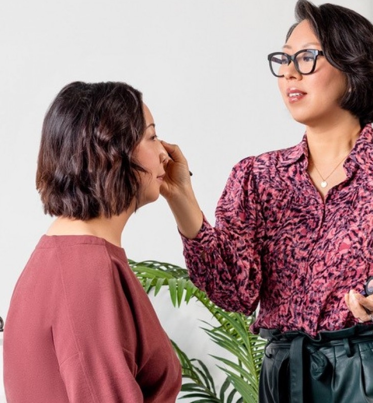 applying makeup at store