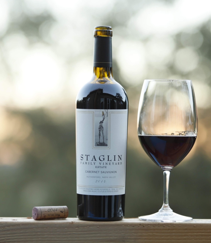 bottle of staglin family vineyard wine with filled glass